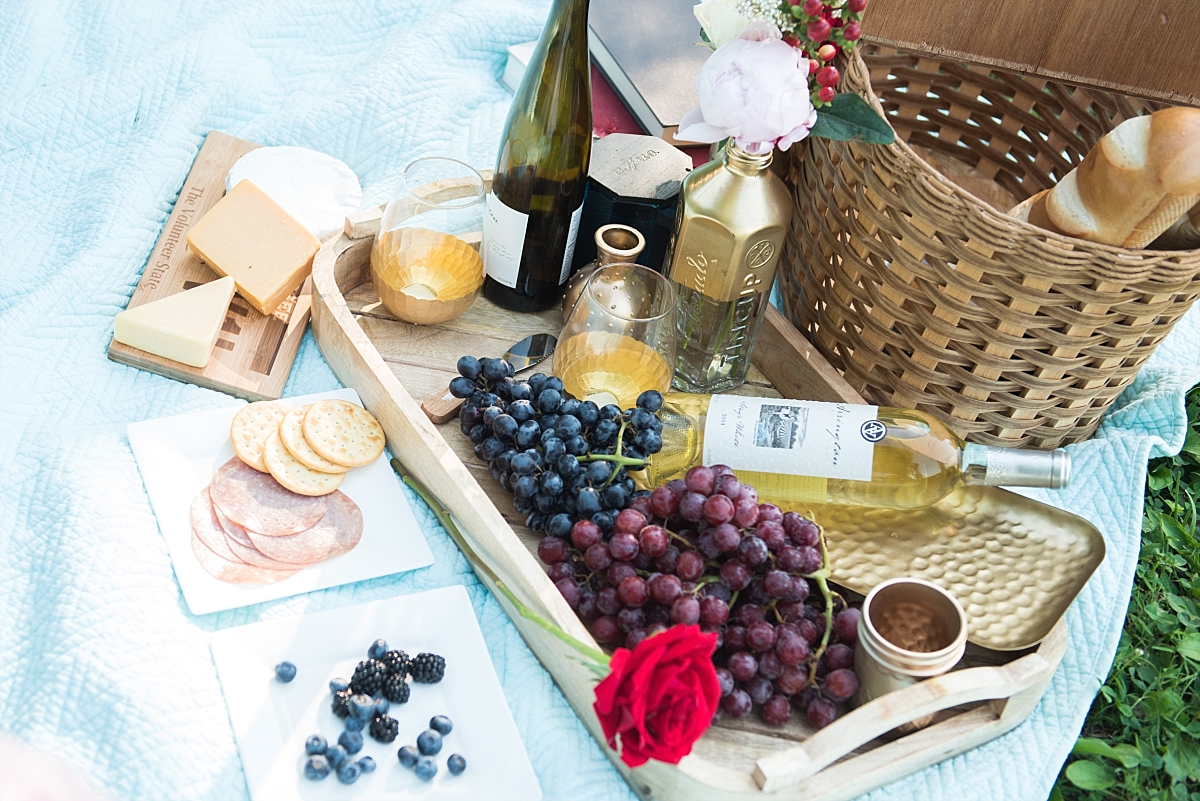 Luxury picnic details of Arrington vineyard wine grapes and crackers