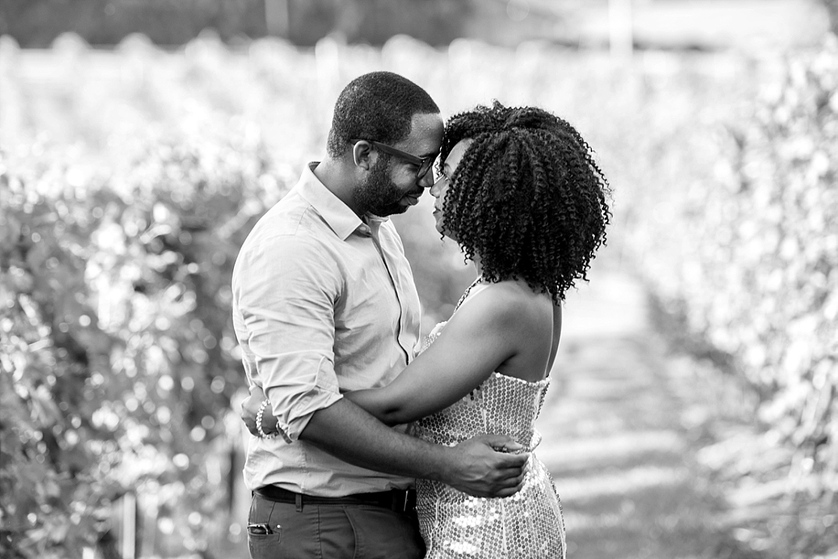 black and white photo of couple in a vineyard