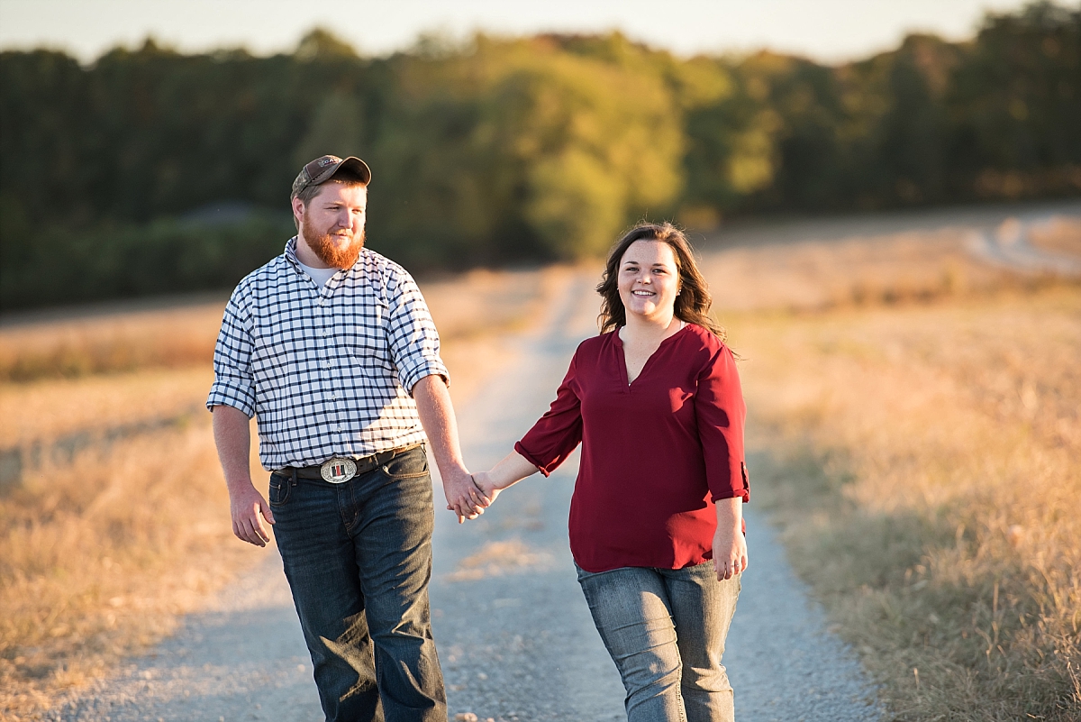 Engaged couple walking on a country road in Murfreeboro