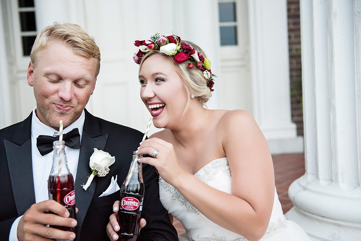 Funny laughter filled picture of bride and groom drinking Cheerwine