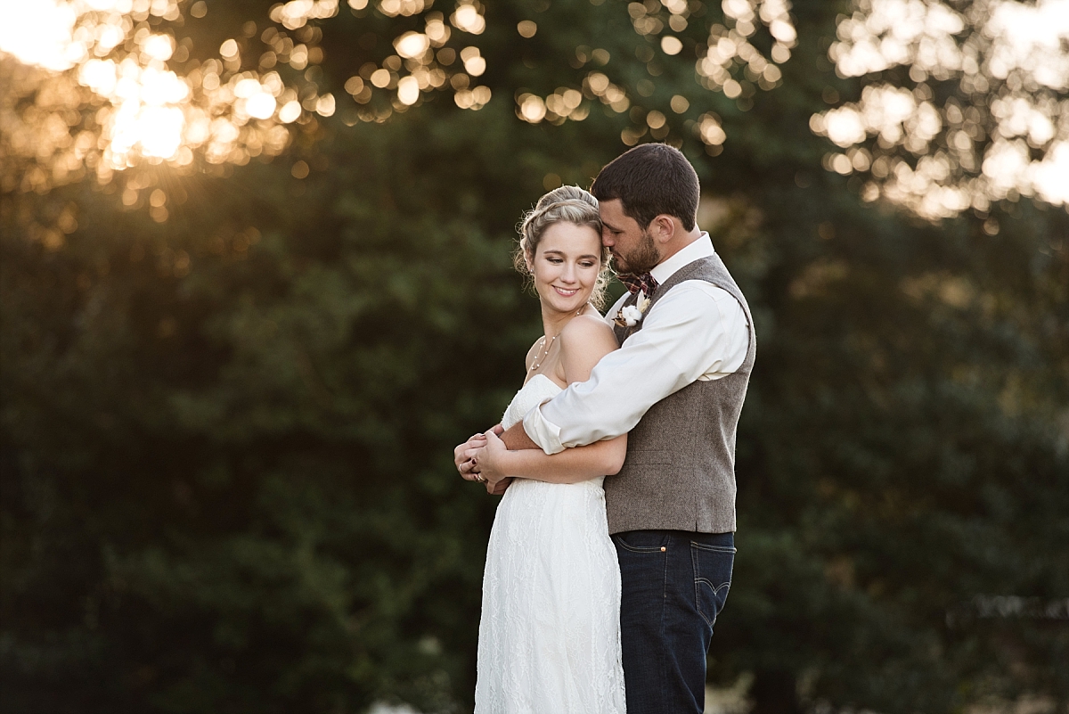 Romantic photo of bride and groom at sunset