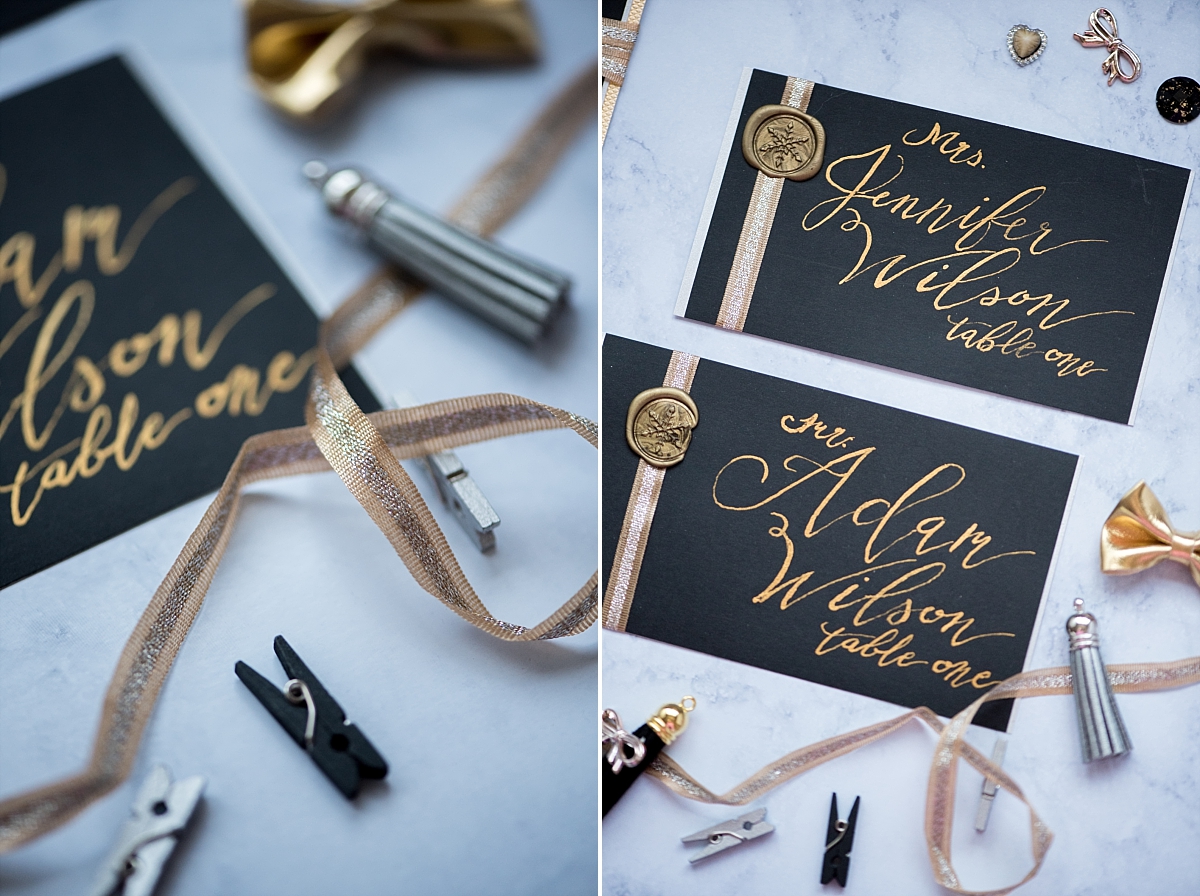 Black and gold seating cards by Tocci Calligraphy