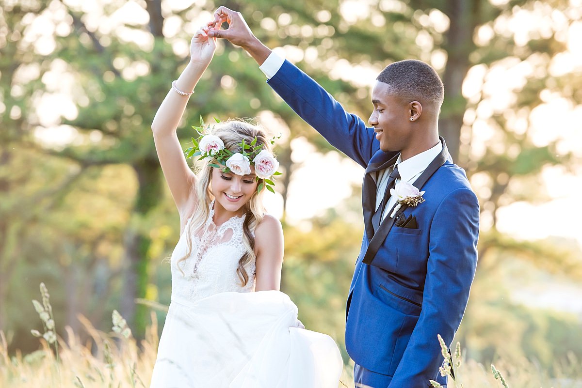 Newlyweds dancing in the field at Stones River country club