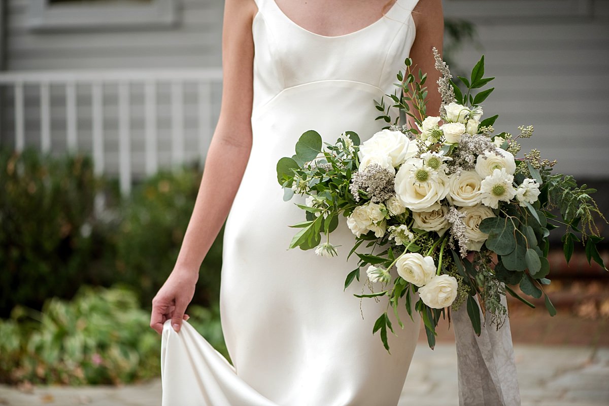 Elegant large bridal bouquet of ivory flowers and greenery