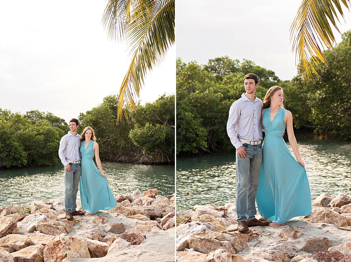 Belize beachfront engagement couple on rocks by ocean