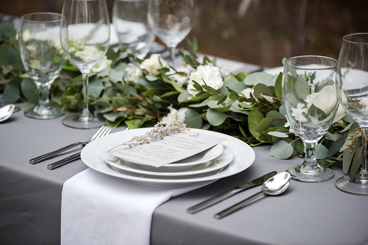 Grey and ivory table design with greenery