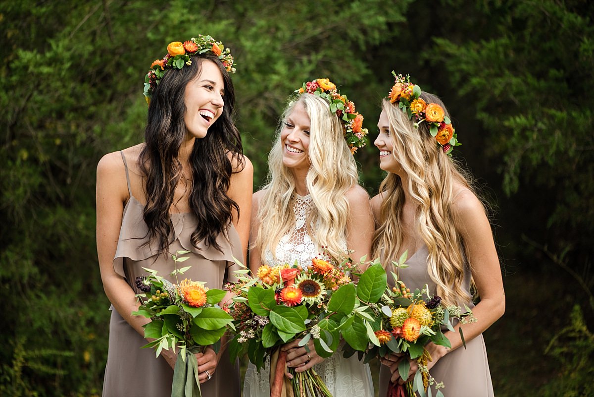 Laughing bridesmaids with a boho look
