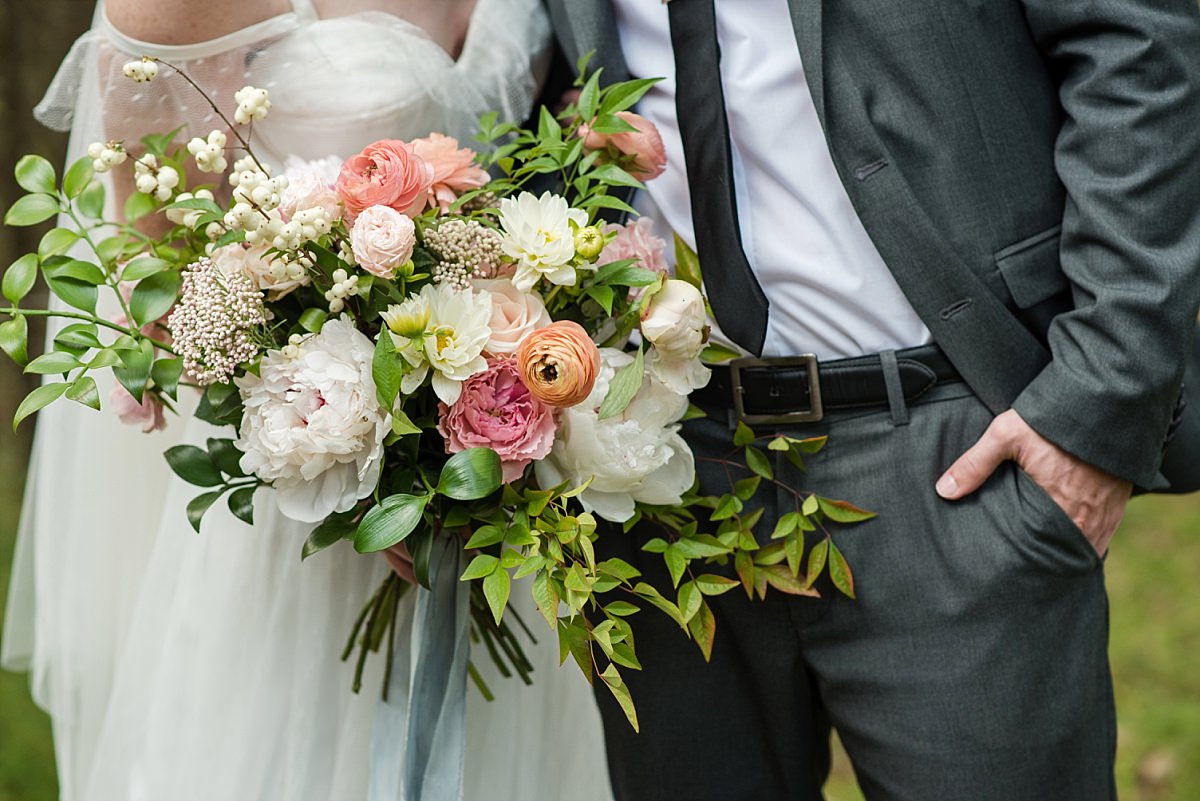 Large oversized bride bouquet of gorgeous pink orange and ivory flowers