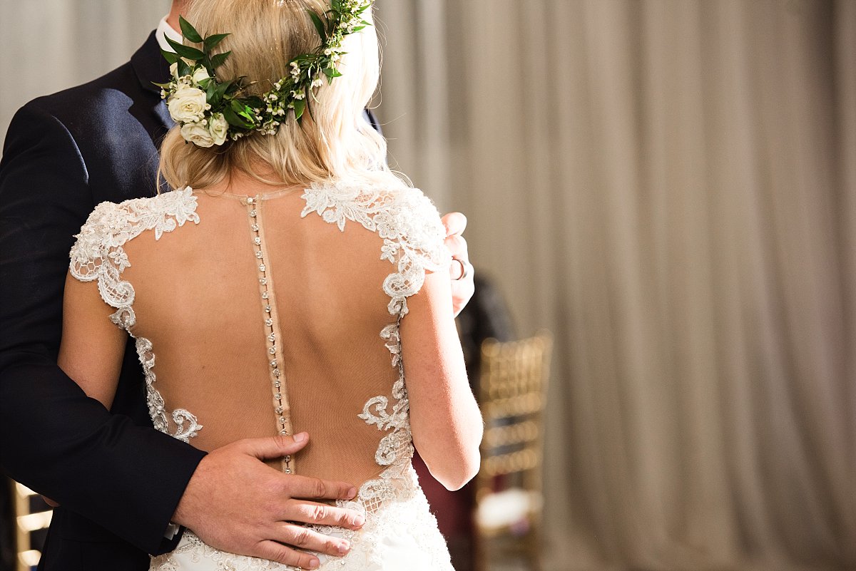 Beautiful lace detailing on the back of the brides dress