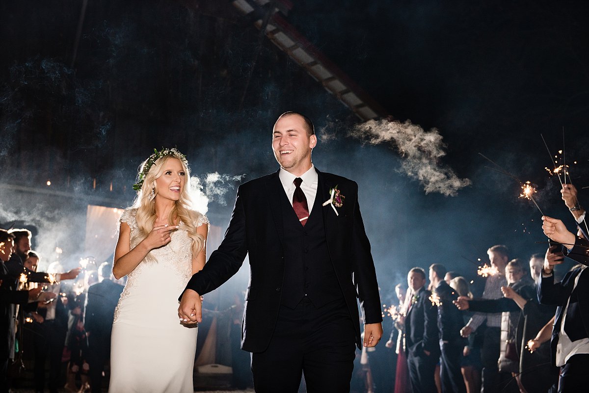 Laughter filled sparkler exit after wedding reception
