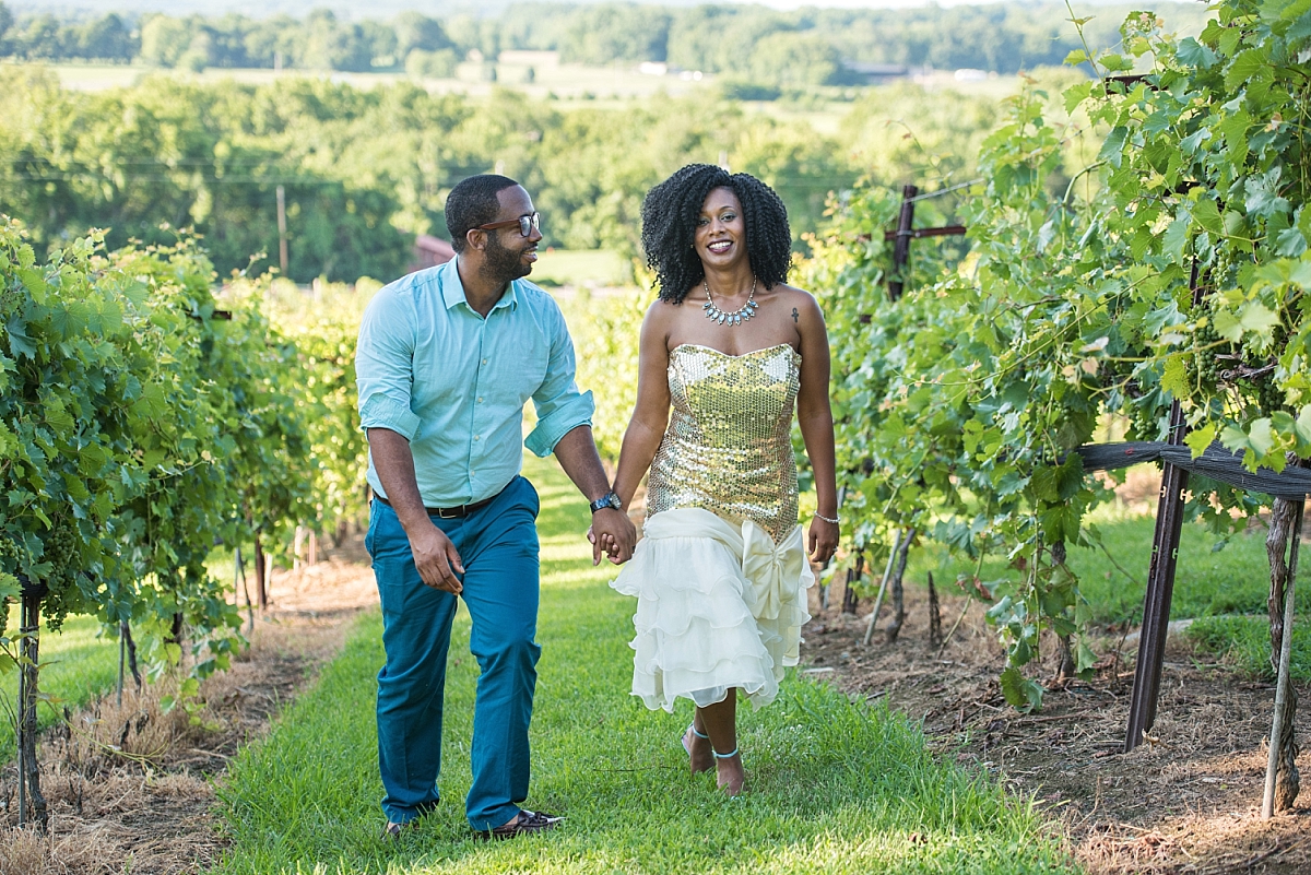 Husband and wife walking through vineyard in Nashville