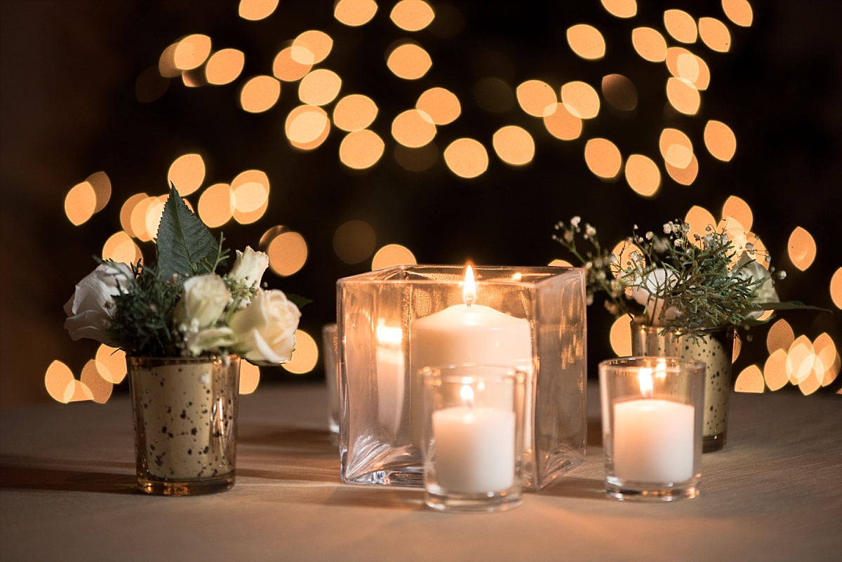 Ivory candles and roses centerpieces