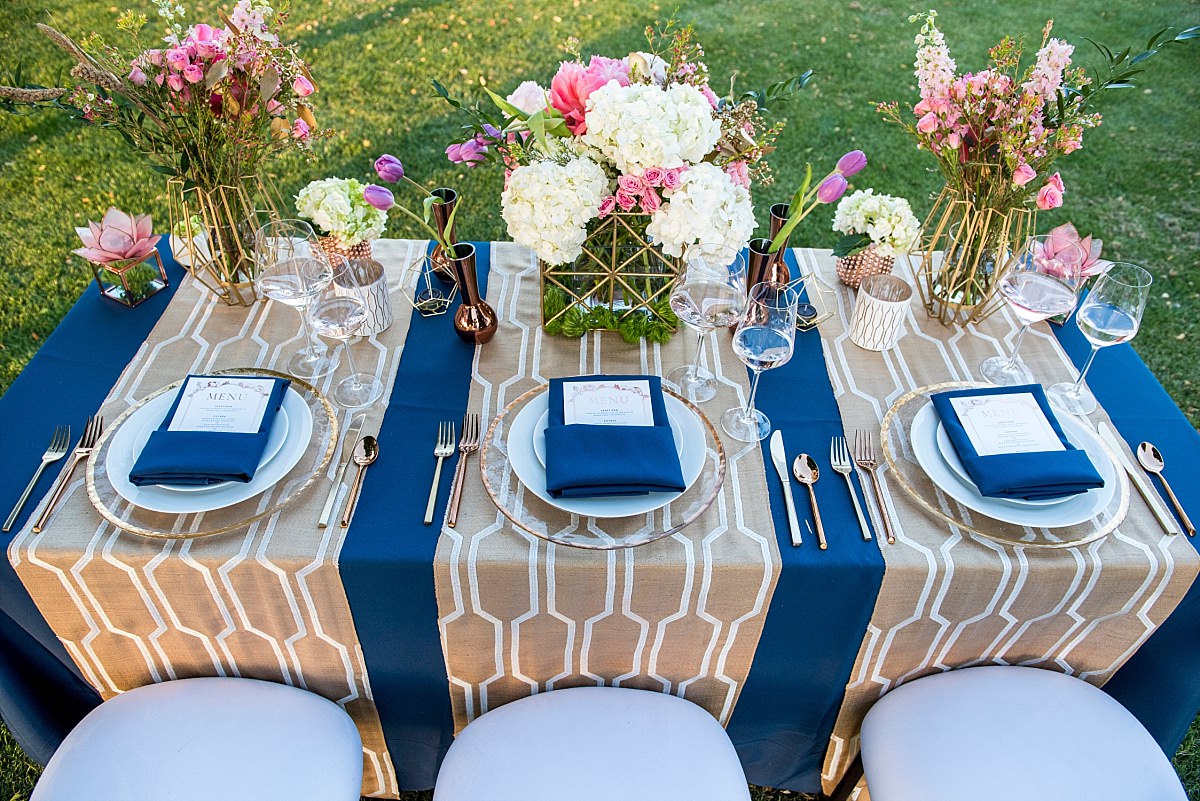 rose gold navy and pink reception centerpieces and table design overhead view of tablescape