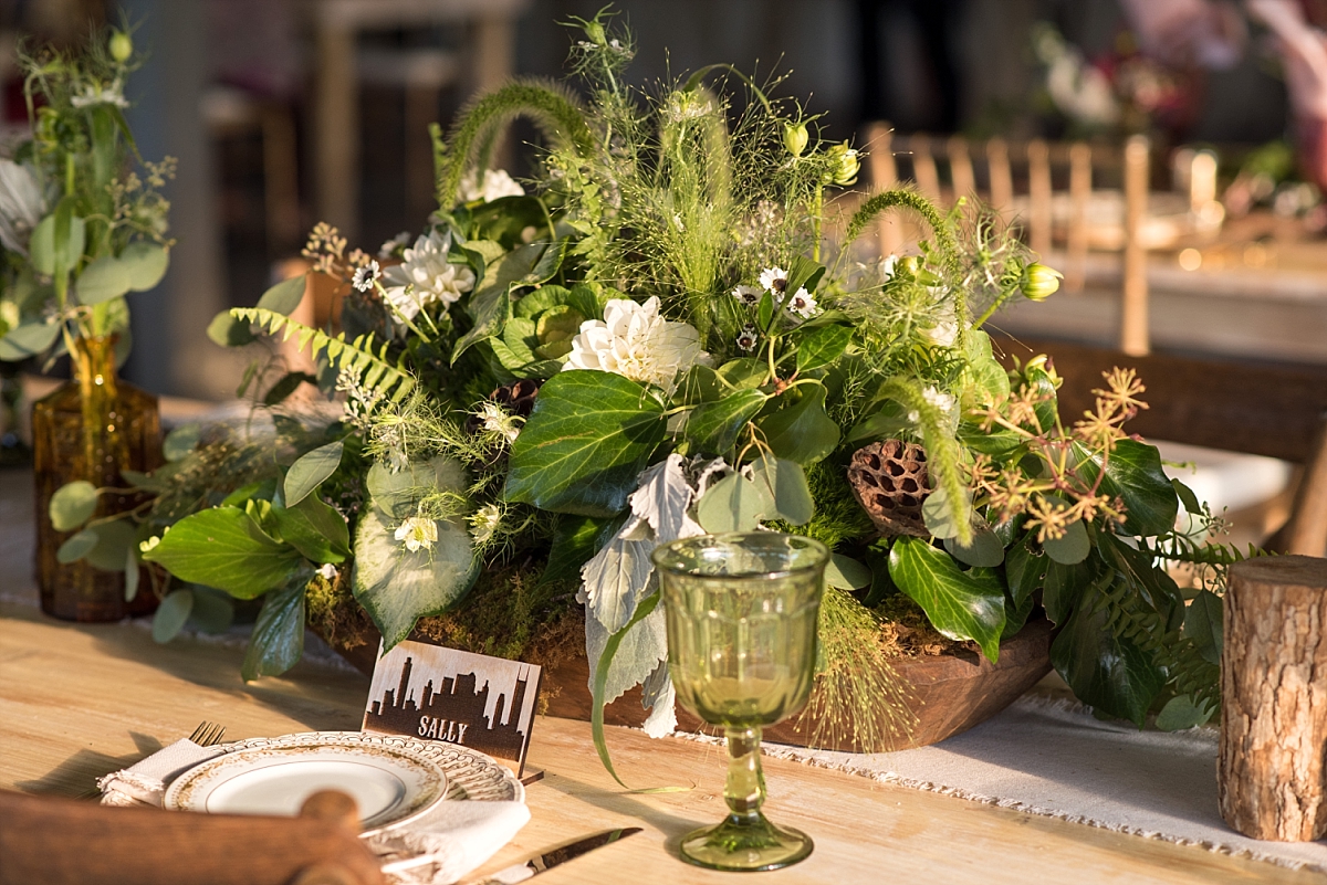 Large centerpieces of greenery and brown elegant wedding