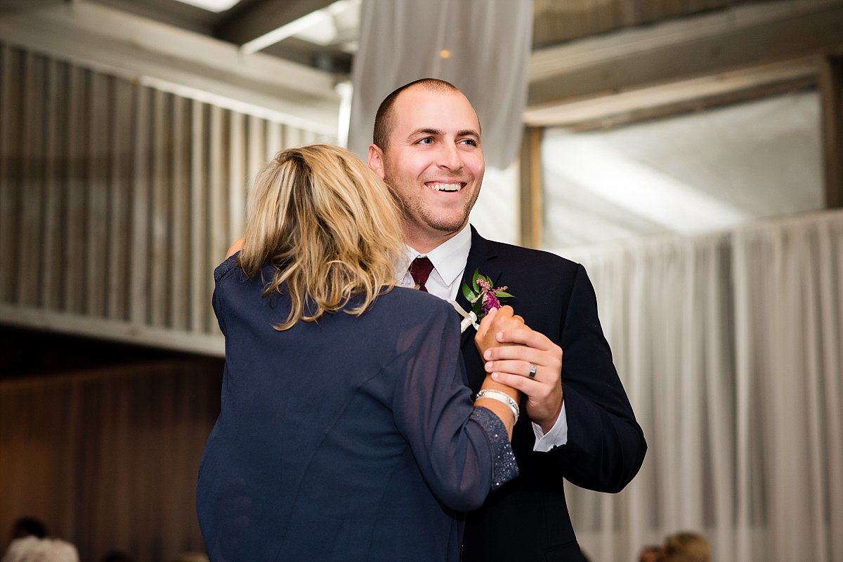 Groom dancing with his mother at reception
